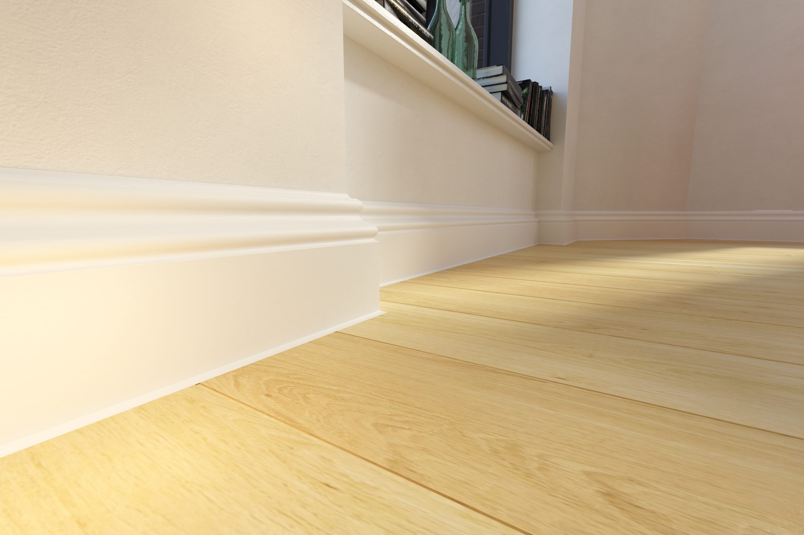 Close view of the Berlin 100 skirting profile at the junction between a light wall and a wood-look floor