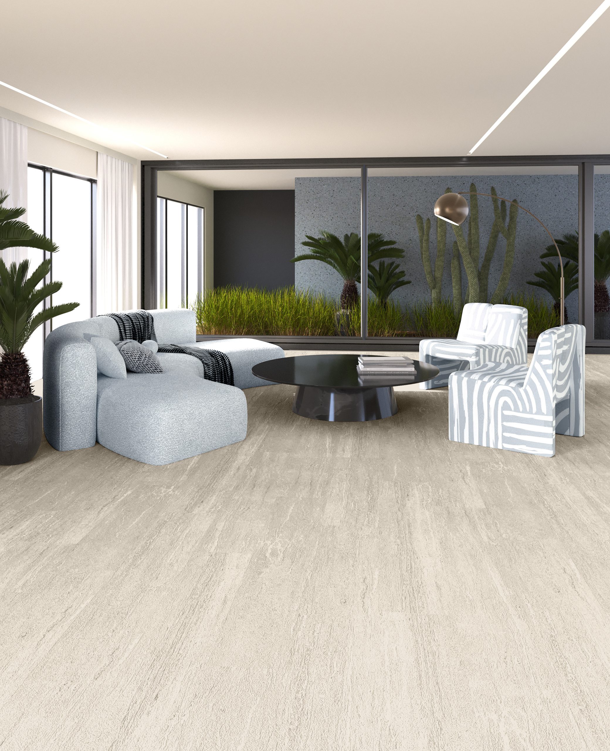 Kermit Travertine P-404 collection interior image with a light beige stone-look floor, pale seating and a glazed garden outlook